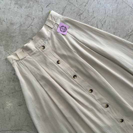 FALDA BEIGE MIDI BOTONES